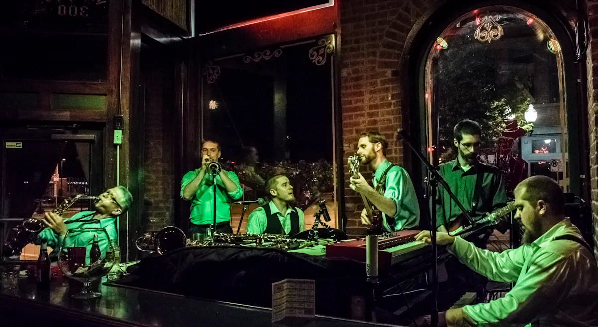 a group of people sitting in front of a window